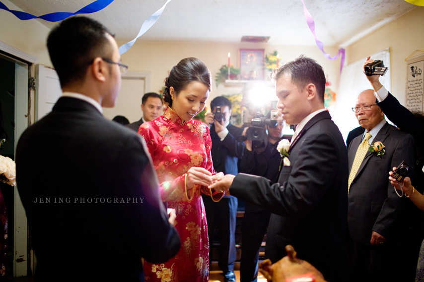 Vietnamese wedding photography - bride and groom exchanging rings