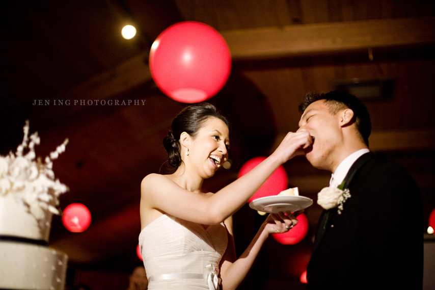Boston wedding photography - bride feeds groom cake
