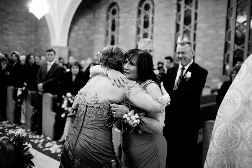 Armenian wedding photography - mothers of bride and groom hugging