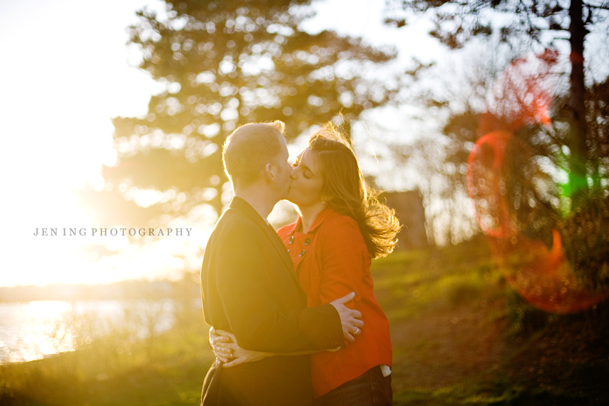 Nahant beach engagement session near Boston, MA - couple kissing in the sunlight