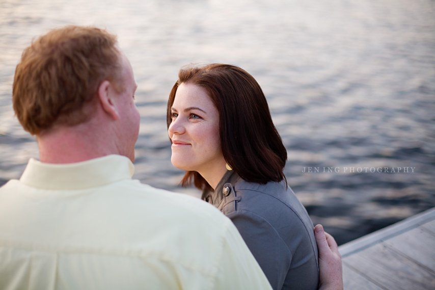 Charles River engagement session in Boston, MA - couple on dock