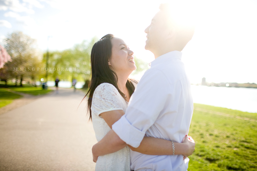 sunny engagement session on the esplanade in Boston - couple laughing