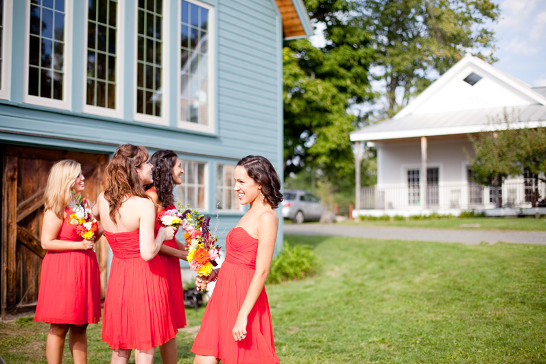 red bridesmaids dresses at a farm wedding