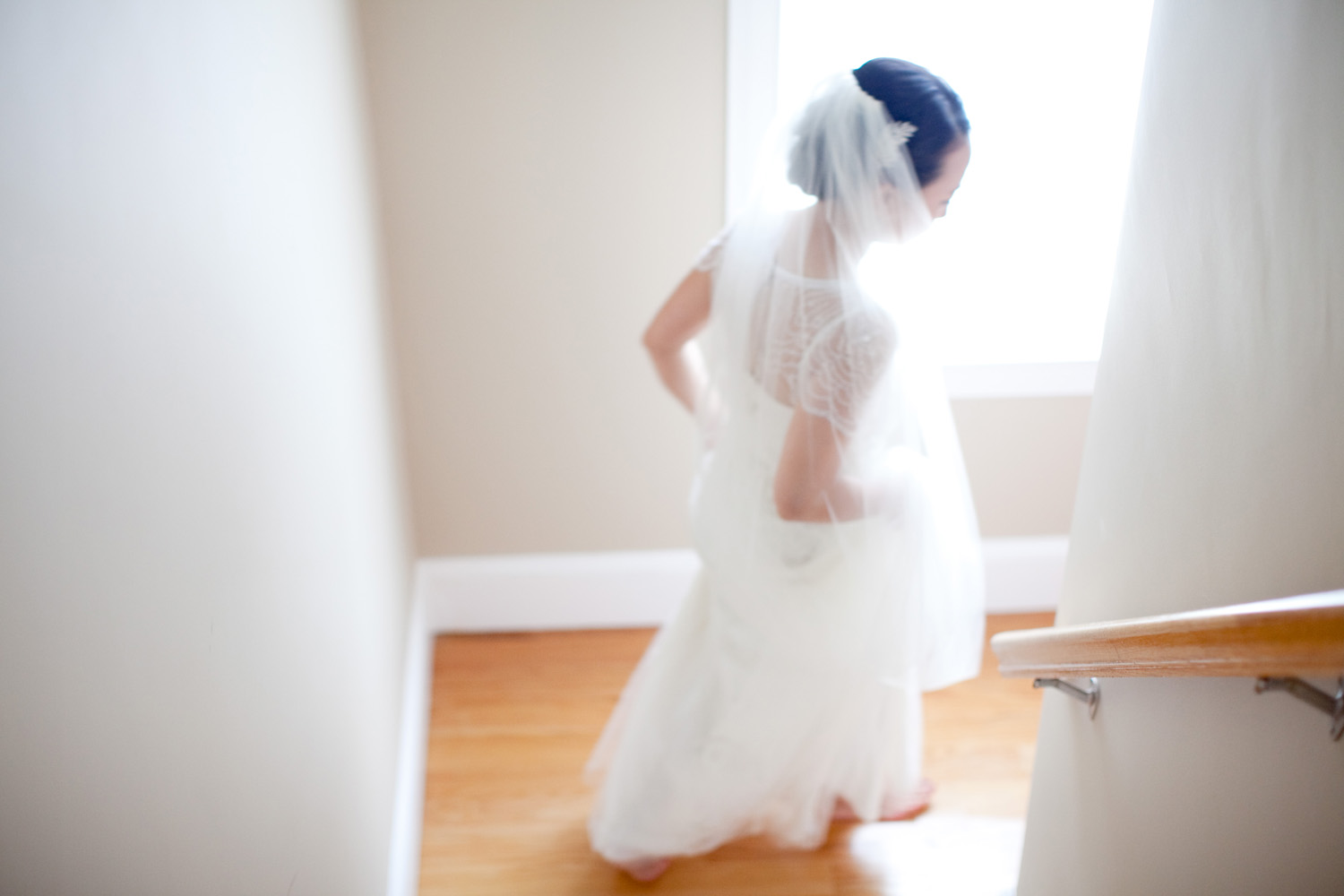 whimsical bride coming down stairs