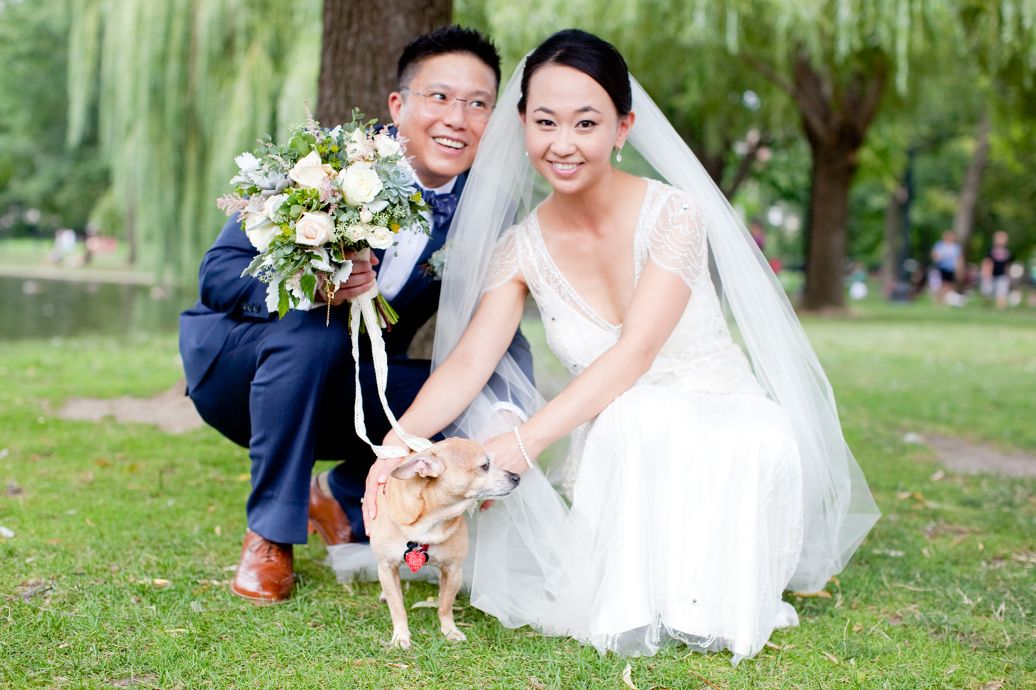 bride and groom with puppy