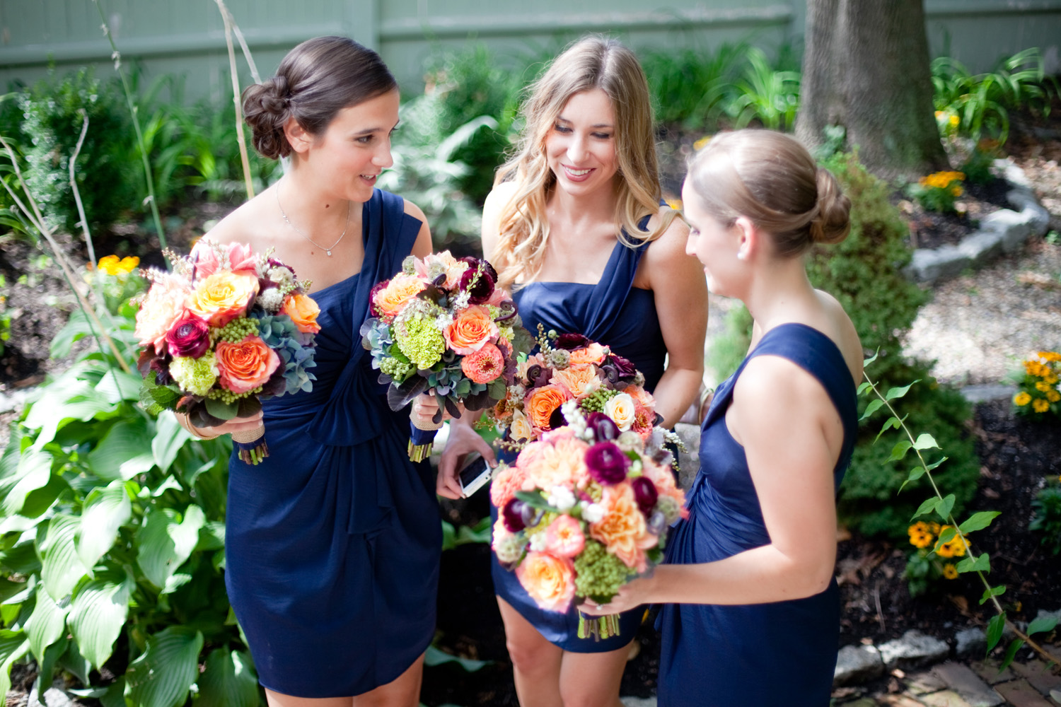 navy bridesmaids with fall floral bouquet